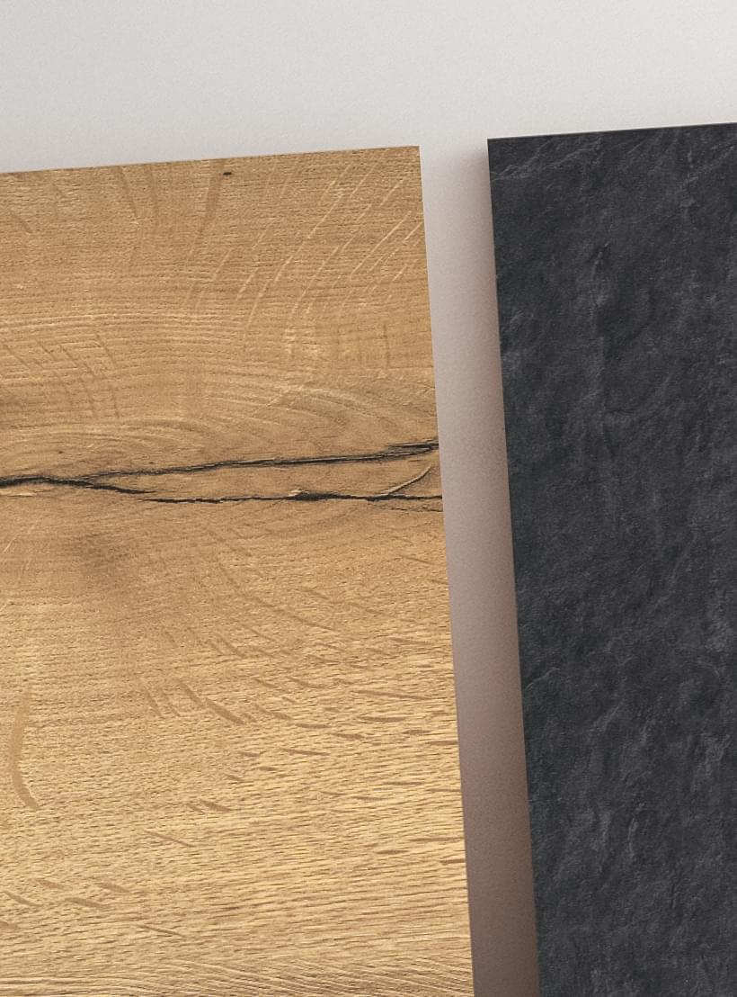 Zwei verschiedene Dekormusterplatten in Schiefer- und Holzoptik.